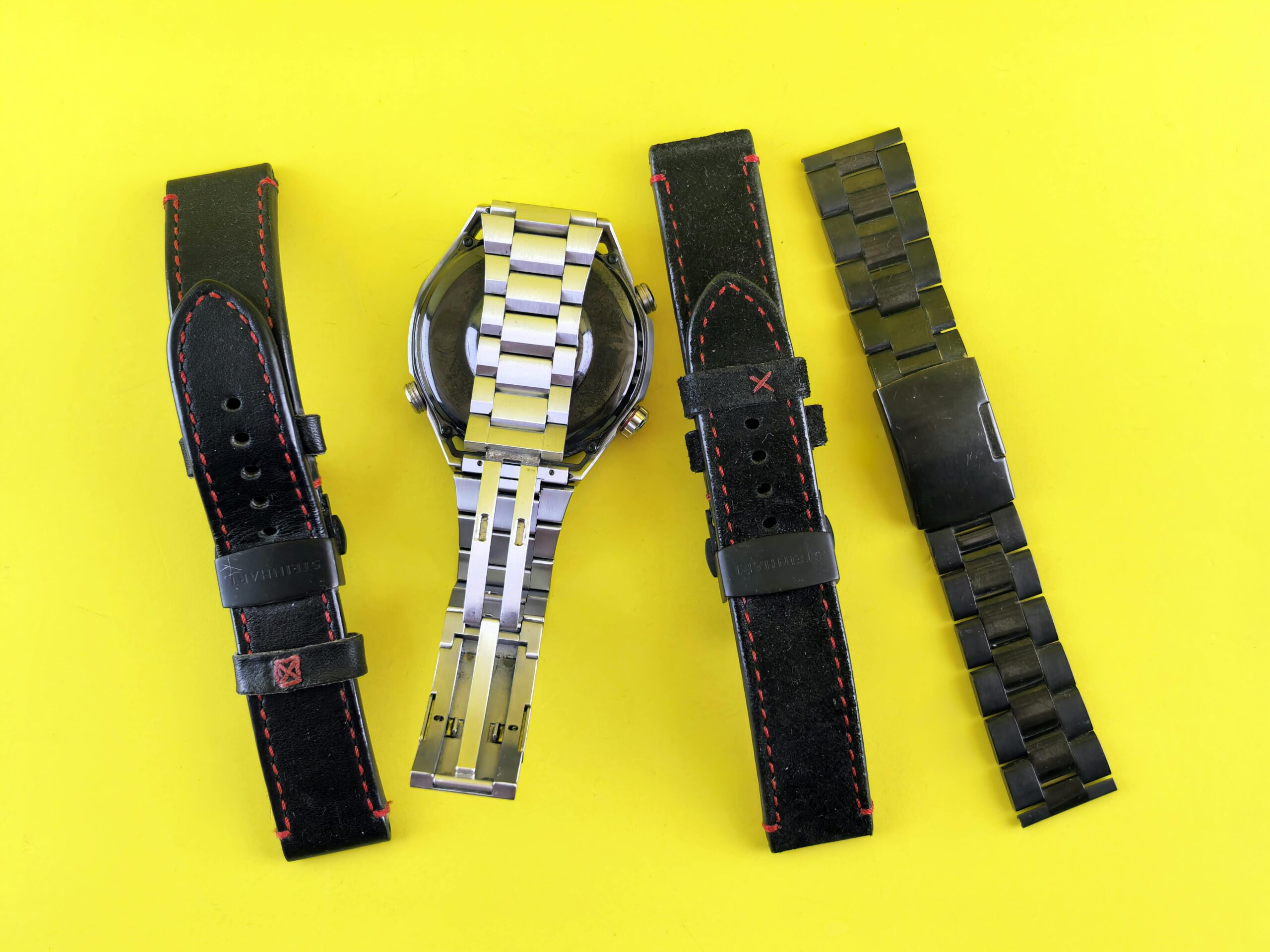 A bland silver watch on a white background highlighting lack of personalization