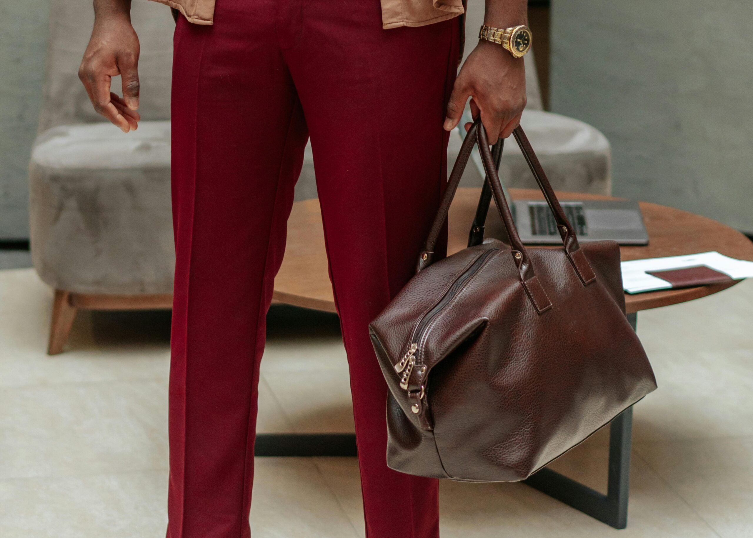 Man adjusting his leather brown watch