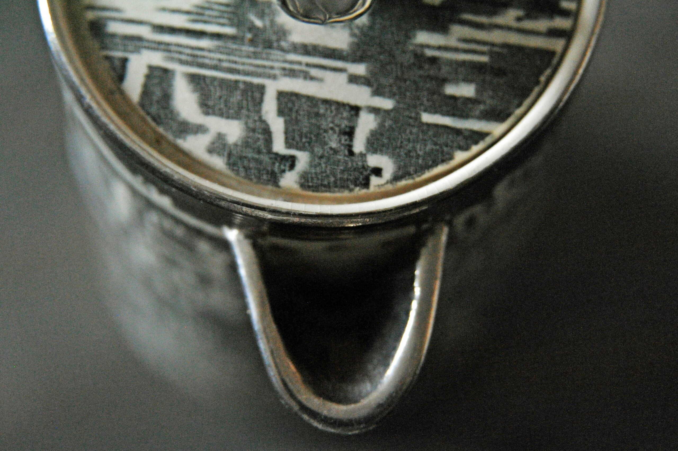 A close-up image of a sleek black monochrome smartwatch on a wrist