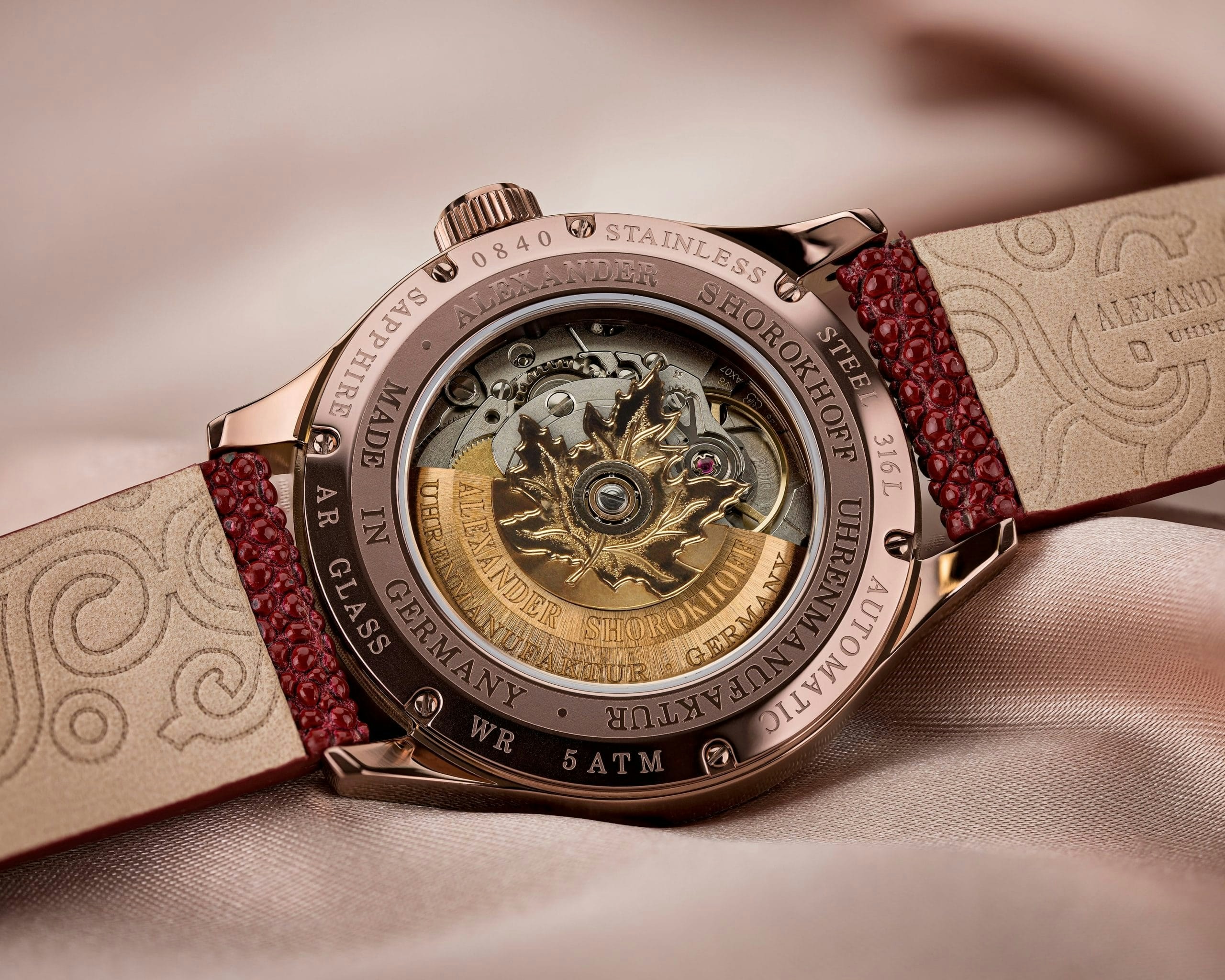 A silver watch clashing with an earthy outfit