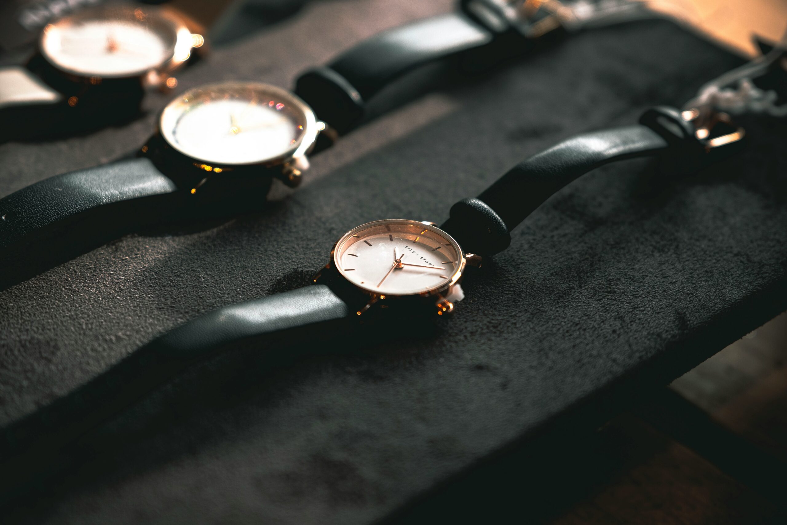 A sleek display of watches with varying colors arranged in a circle