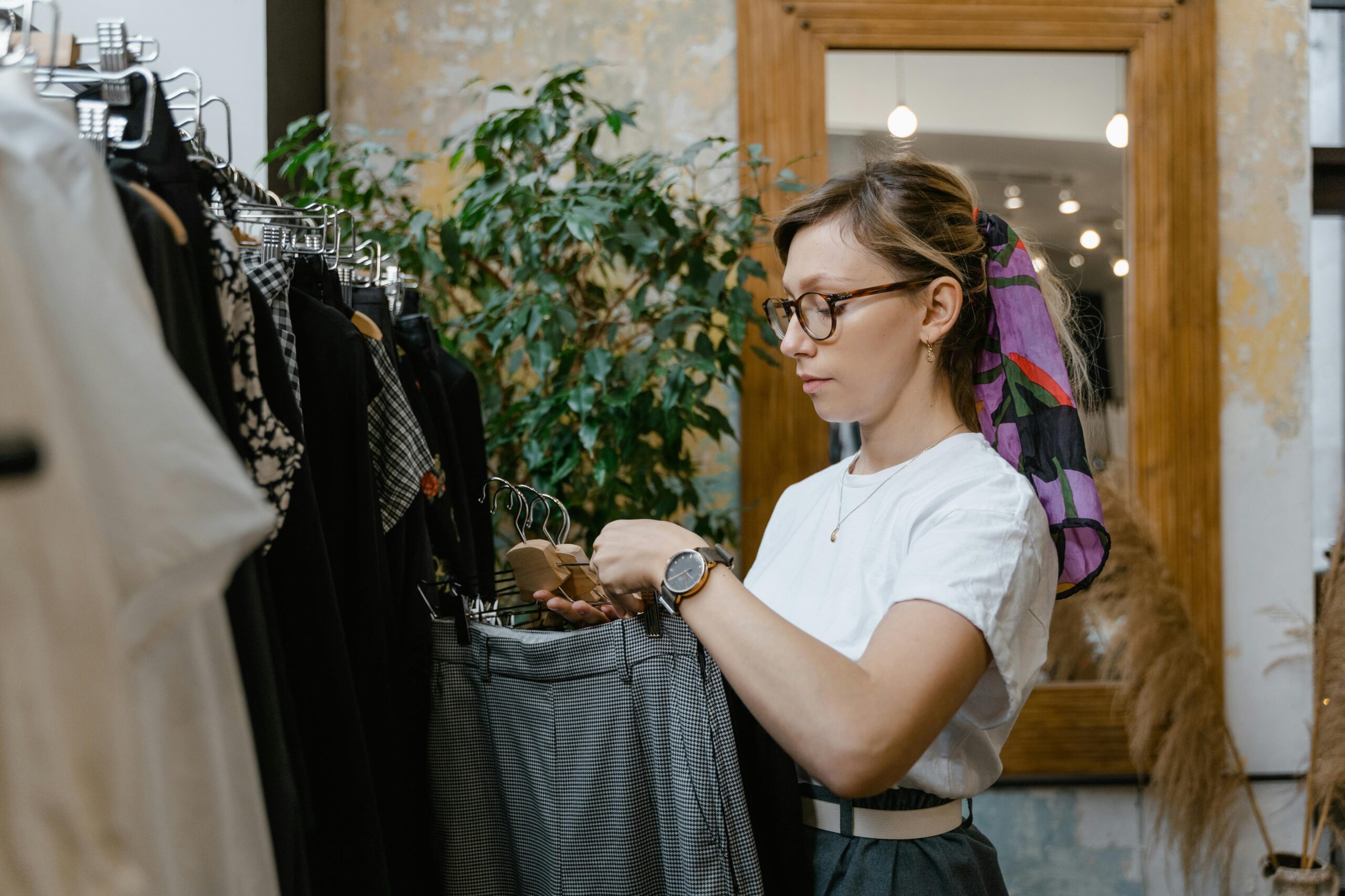 A woman wearing a Daniel Wellington watch with a scarf
