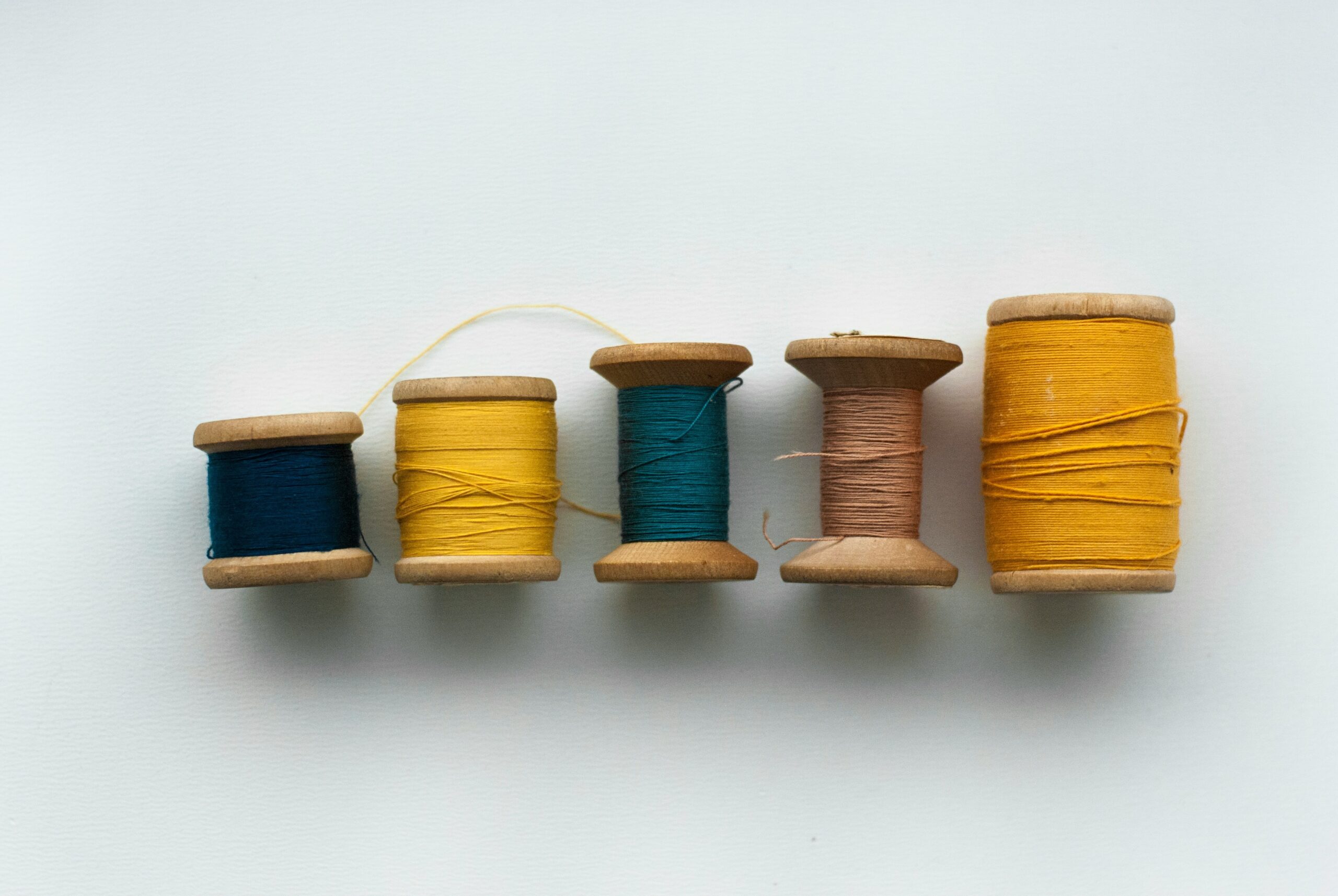 An array of interchangeable bands in different materials and colors laid out neatly.