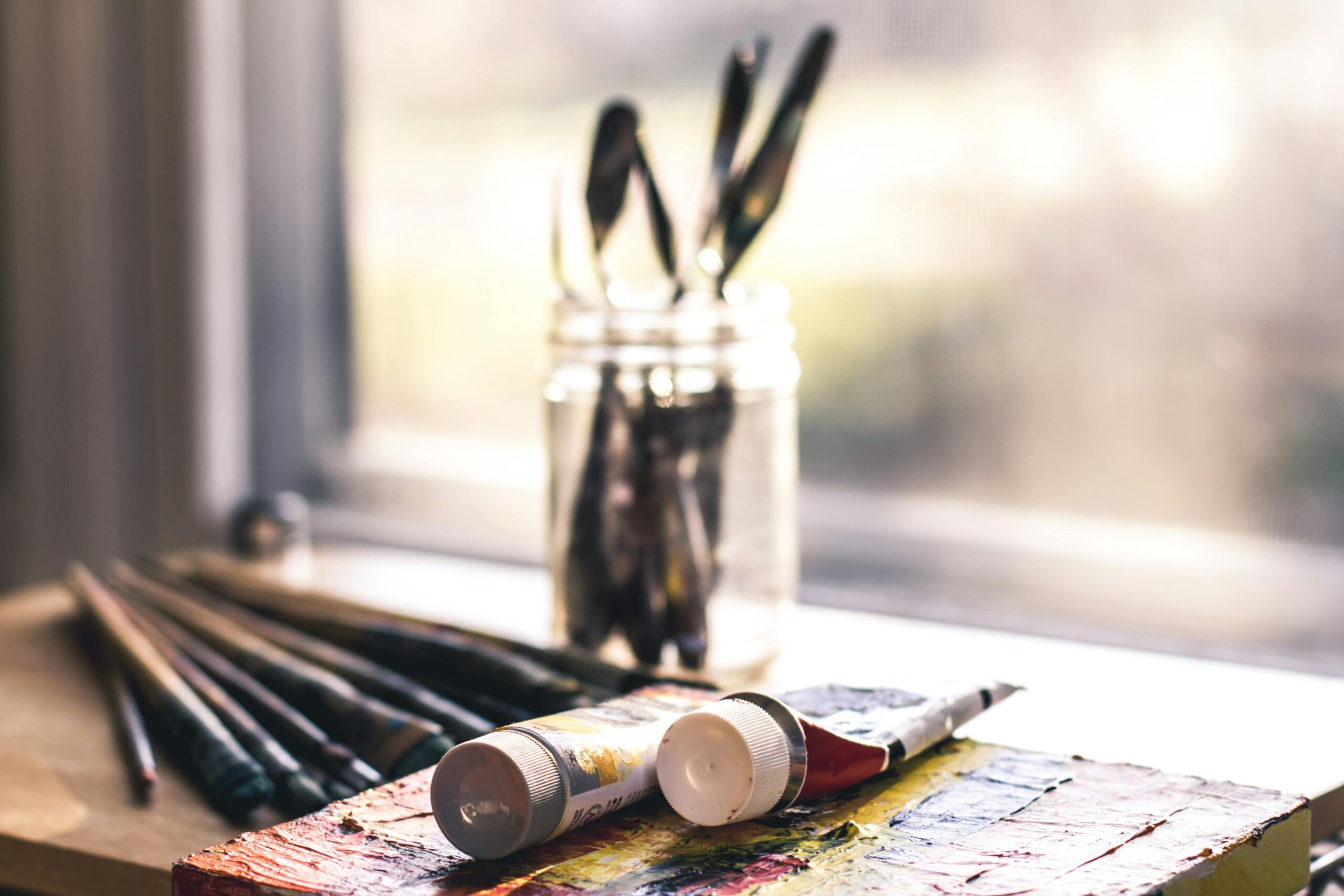 Artists painting watch dials in a studio