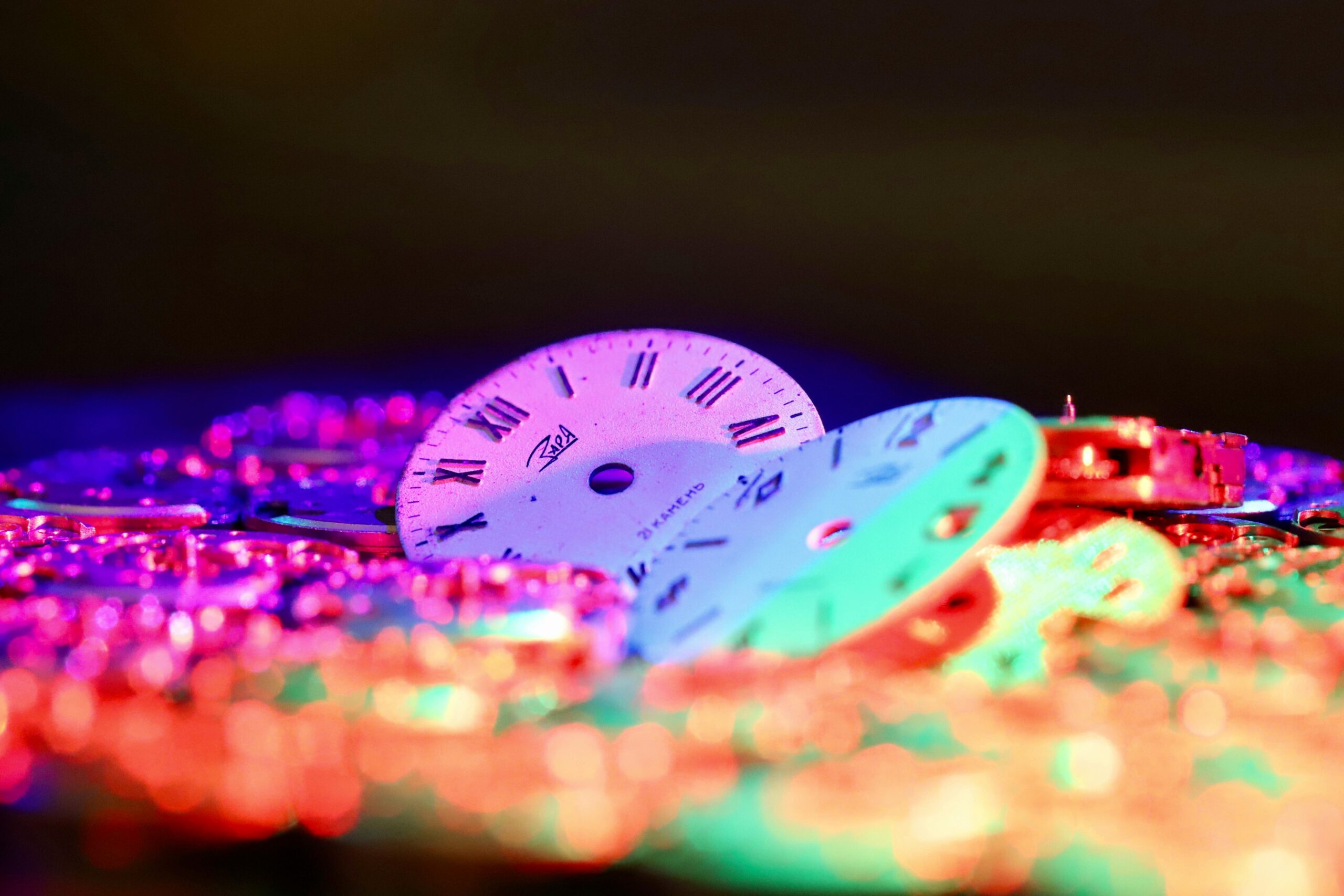 Close-up of a Rolex watch showing interchangeable bezels in different colors
