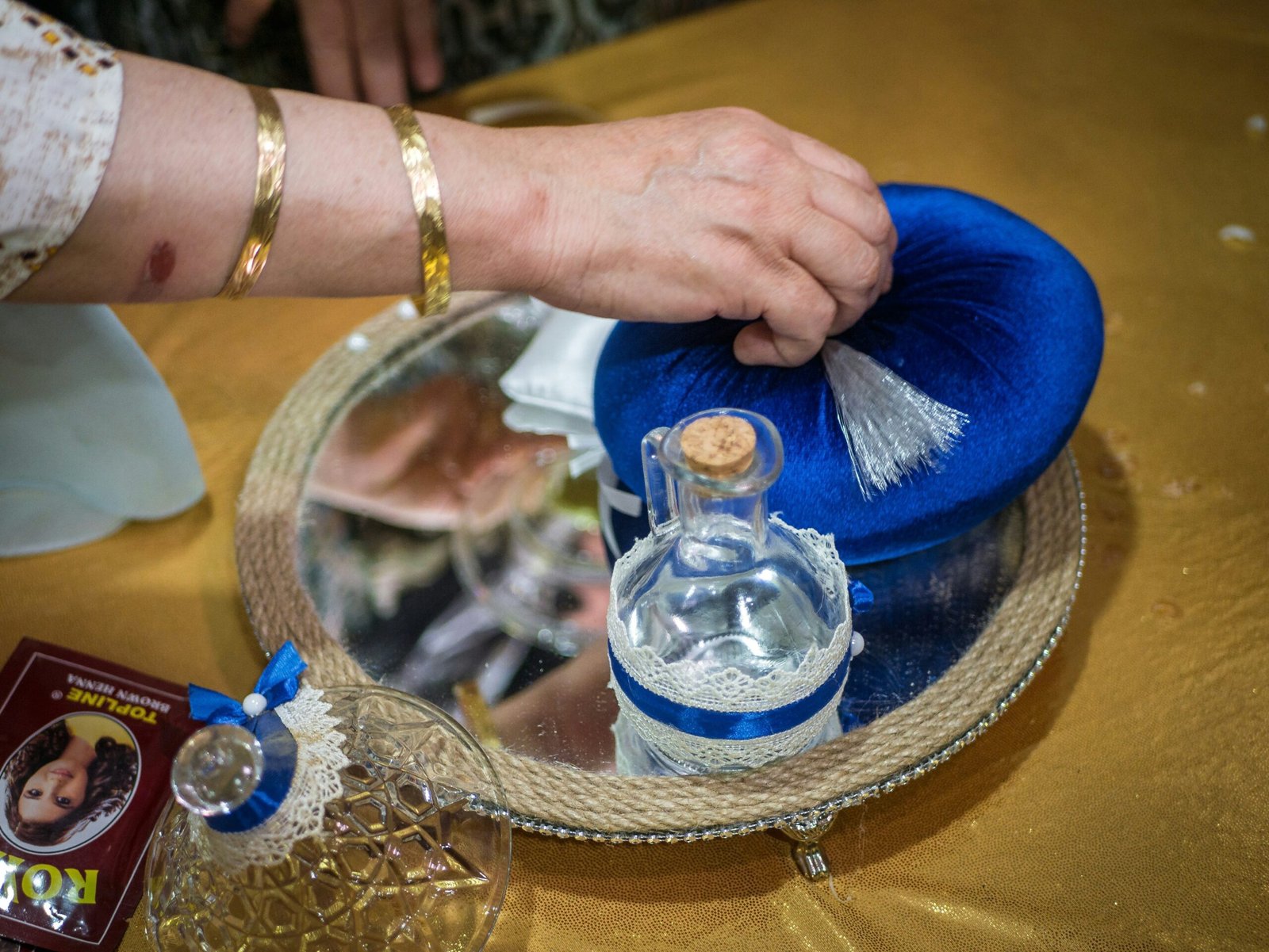 Tiffany blue gift box containing a silver watch and a ribbon