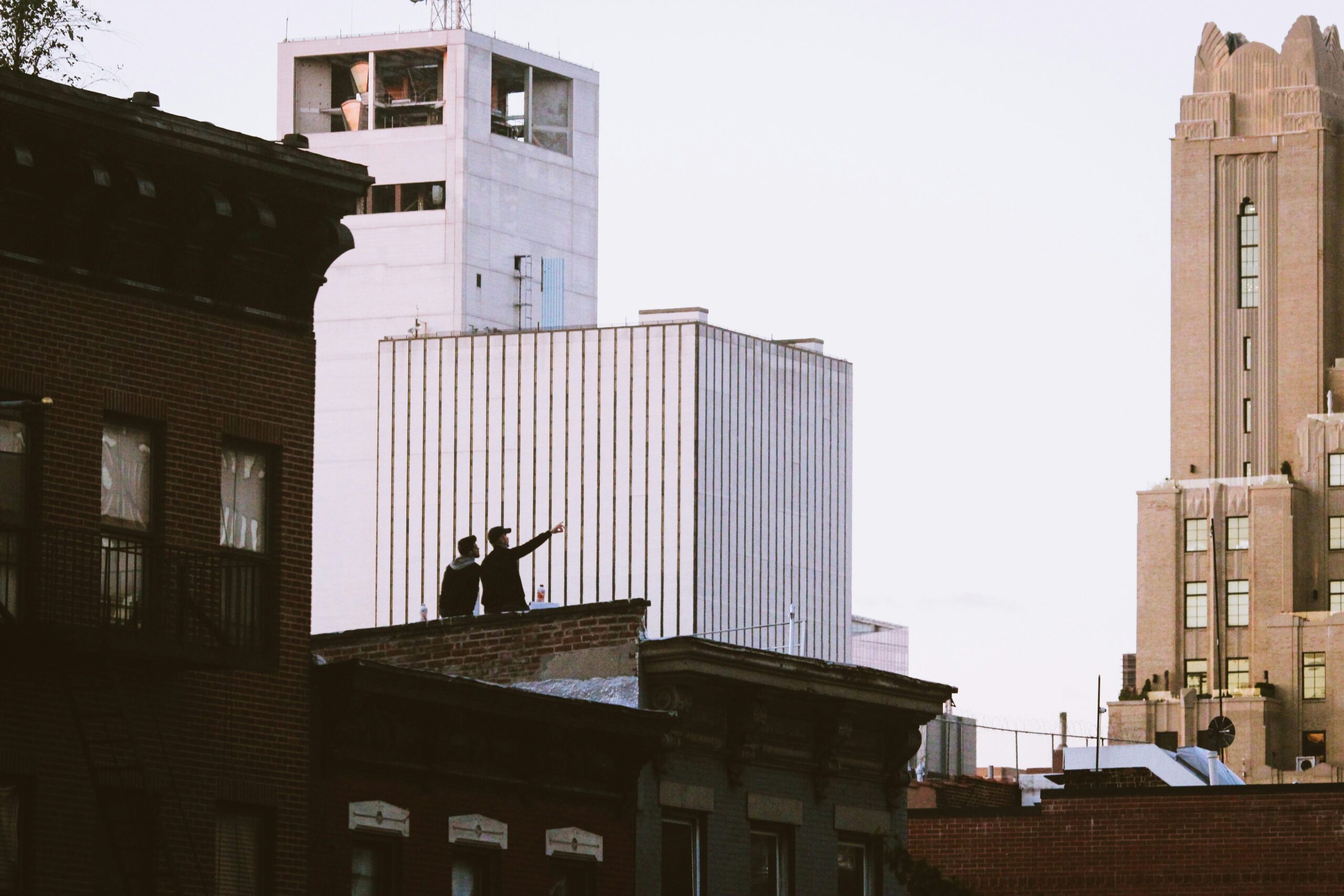 Man wearing navy suit and rose gold watch at rooftop event