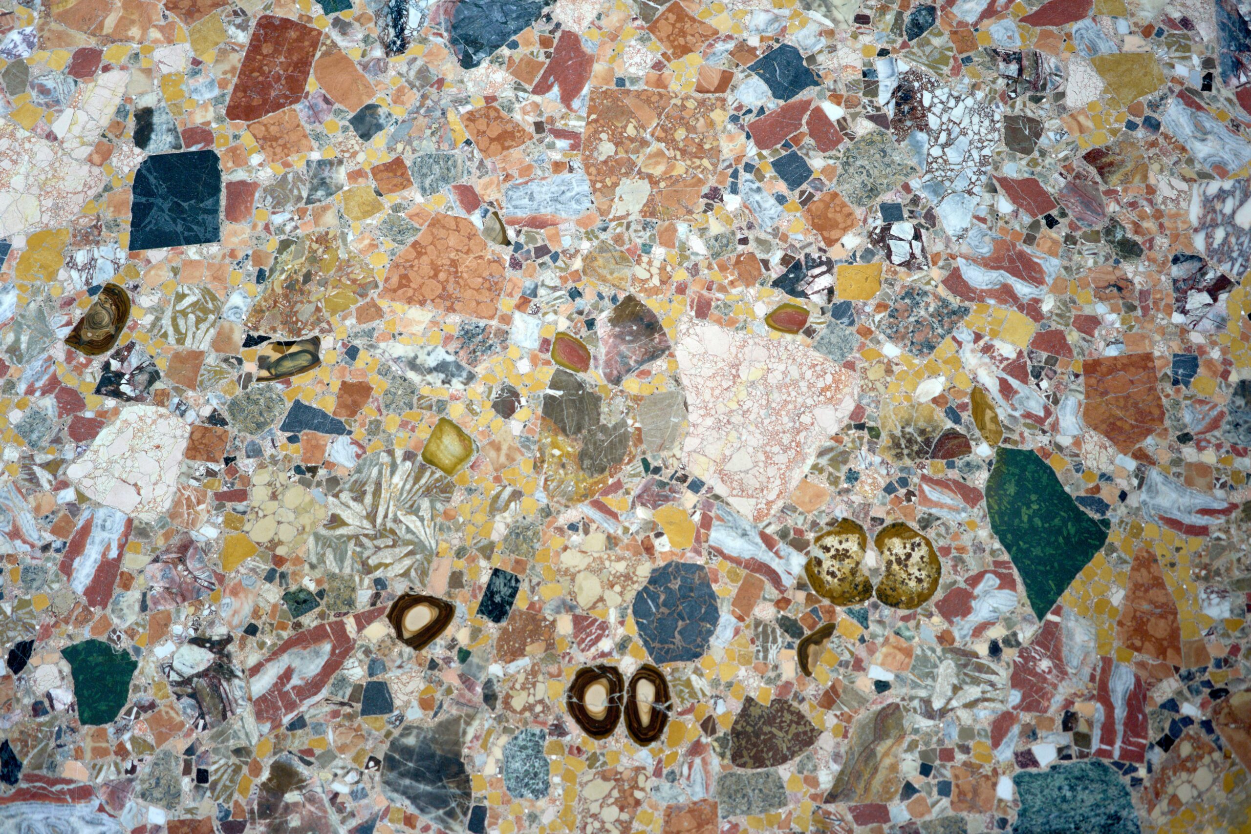 Metallic watches displayed on marble surface