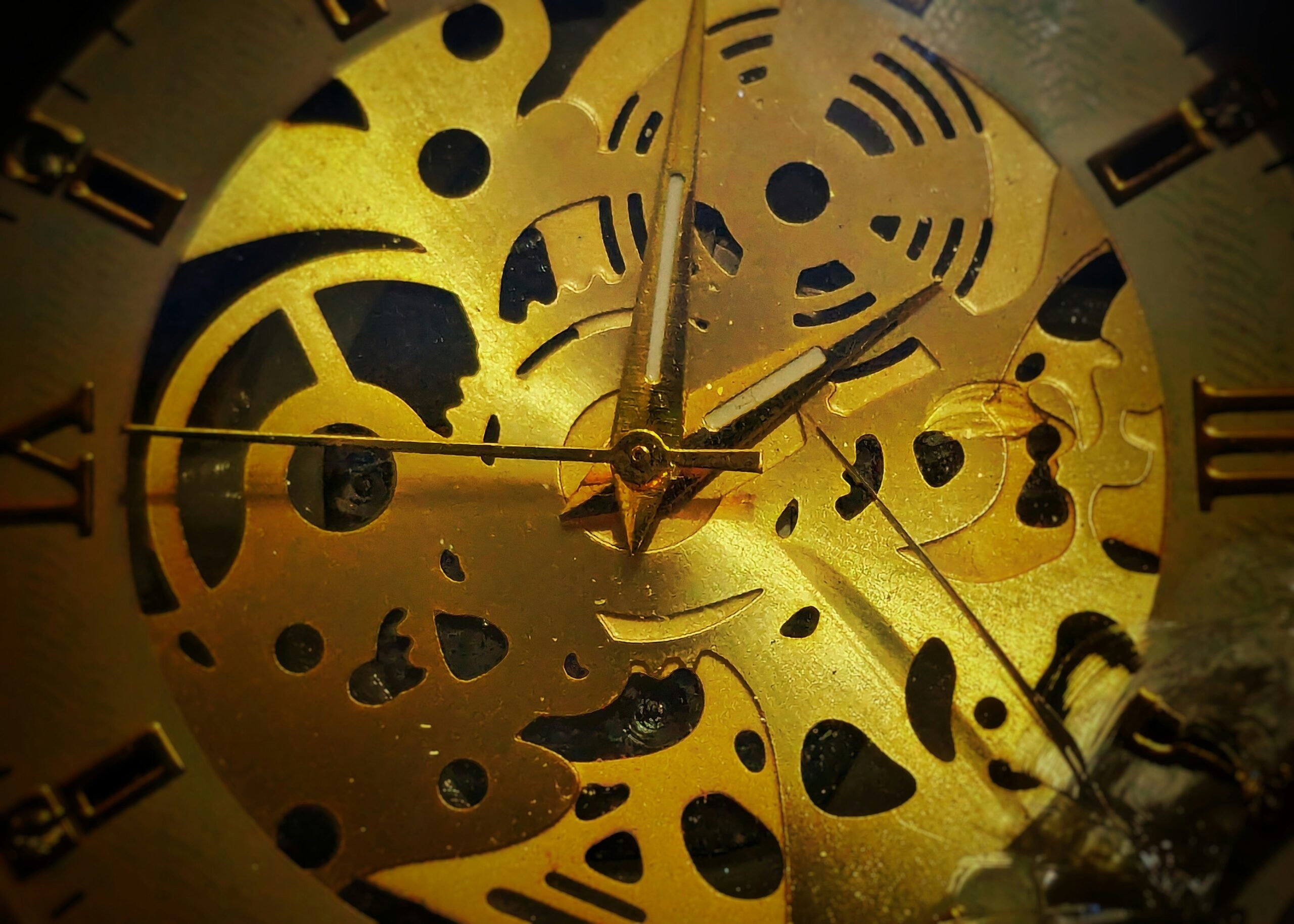 Close-up of a hand-painted watch dial featuring intricate floral patterns