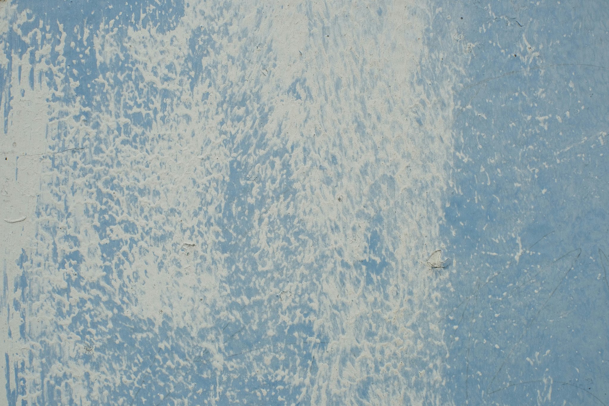 Close-up image of a sleek silver analog watch against a backdrop of snowflakes