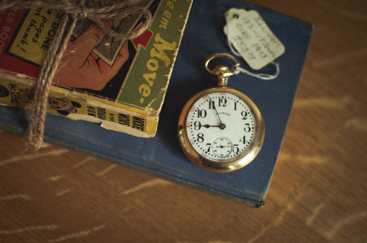 Close-up shot of vibrant vintage-style watch dials displaying brown, blue, and green hues