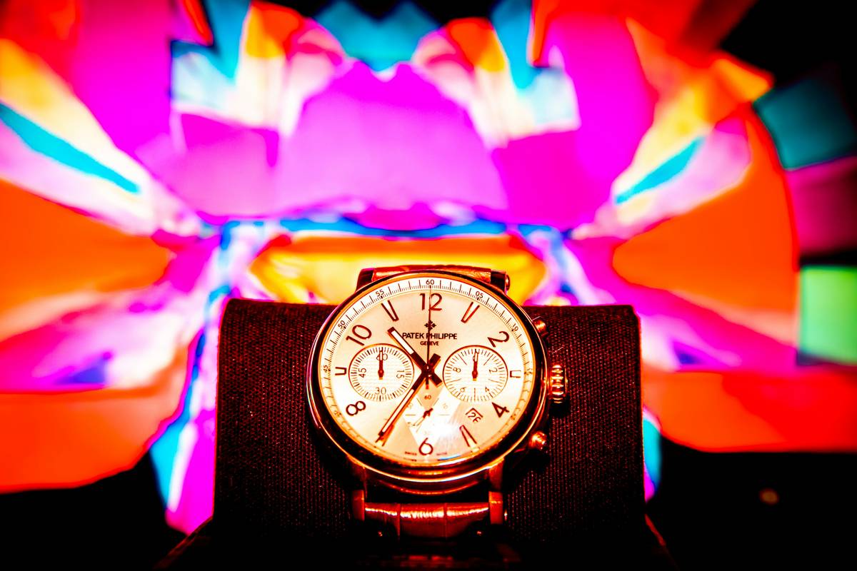 Luxury watches displayed on velvet cushions in a boutique