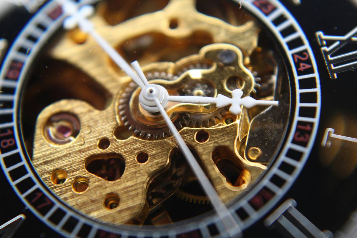 Magnified view of intricate enamel detailing on a luxury watch face.