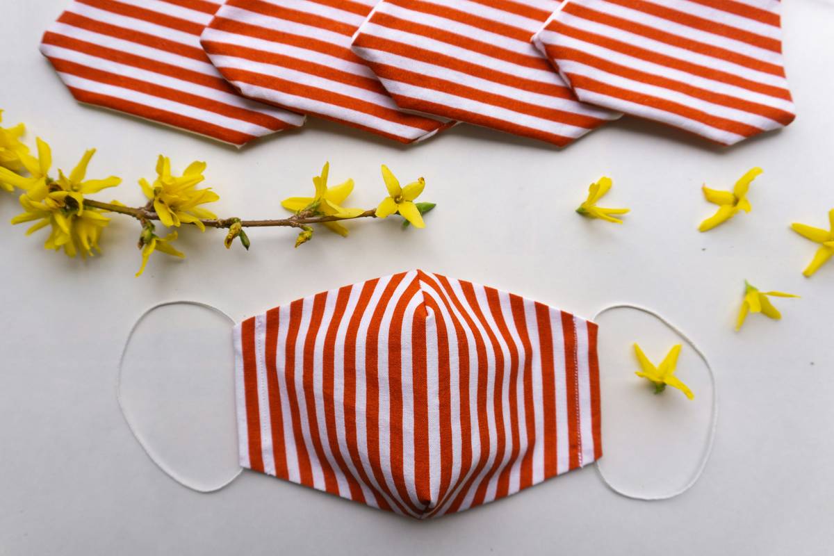 A selection of spring pastel metallic watches displayed on white fabric