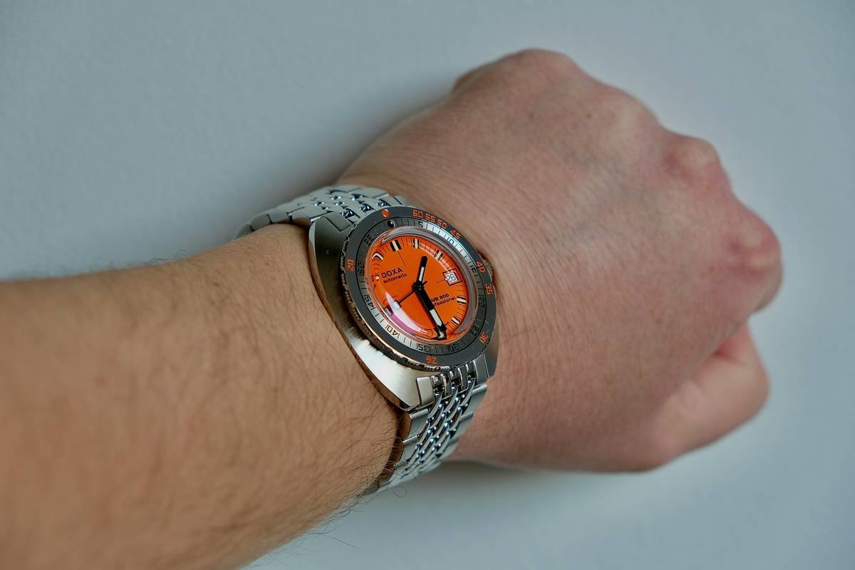 Close-up of a multi-layered watch face showing gradient colors and metallic accents